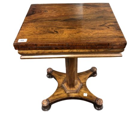 A William IV rosewood turnover top card table on quatrofoil base.