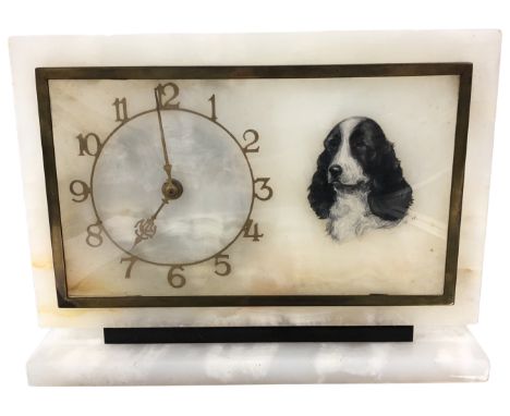 An Art Deco alabaster mantel clock, decorated to the right with a hand-painted portrait of a spaniel, height 19 cm, width 25 
