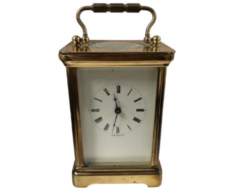 A 20th century brass carriage clock with key.