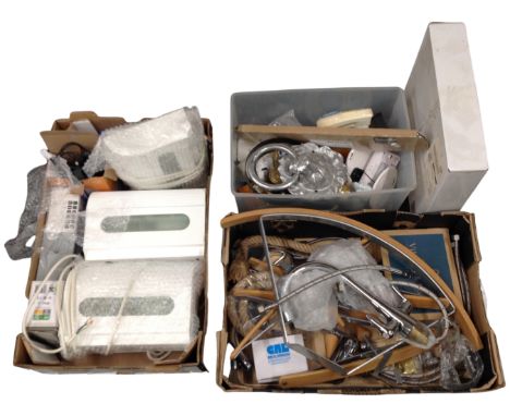 Three boxes containing plumbing fittings, a door knocker, electrical items, socket etc.
