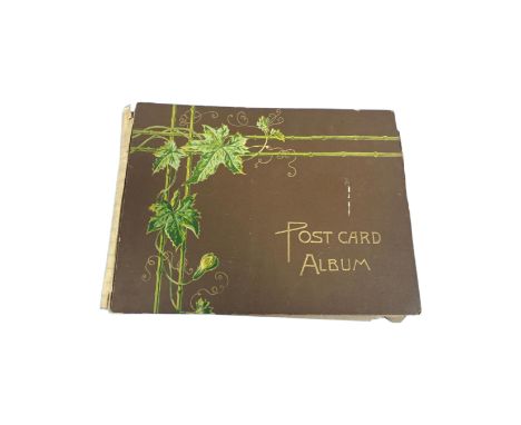 An antique postcard album containing postcards of military interest, First World War etc.
