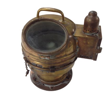 A vintage brass ship's binnacle.