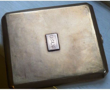 A 9 carat yellow gold Cigarette Case having engine turned decoration and vertical rectangular monogrammed cartouche "CWCS", a