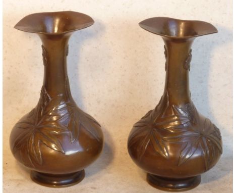 A good pair of Japanese Meiji period patinated bronze baluster shaped Vases, each with pointed oval shaped tops above slightl