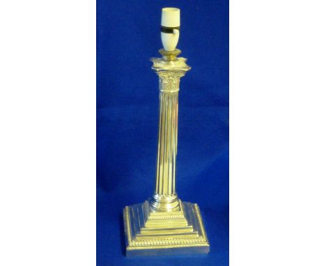 A large late 19th/early 20th Century silver plated Corinthian Column (as a lamp), one lower side of the stepped plinth base s