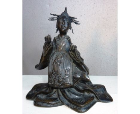 A 19th Century Japanese Meiji period Bronze of a kneeling Geisha in long flowing robe, her elaborate headdress above outstret
