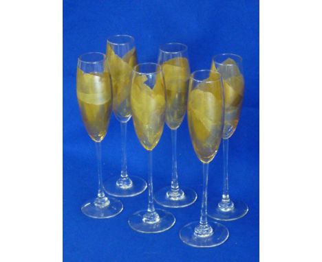 A set of six glass Flutes, each individually decorated with gold leaf, each signed R (Randy) Strong and dated 1993 (USA) to t
