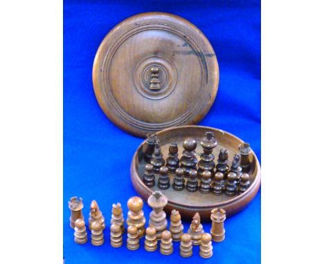 An unusual late 19th Century circular boxed (possibly sycamore?) carved  Chess Set, (some "minor" damage to pieces), height o