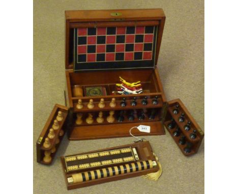 A Victorian mahogany Games Compendium with boxwood and ebony Chess Pieces by Jaques (Chess Pieces marked with a red crown), o