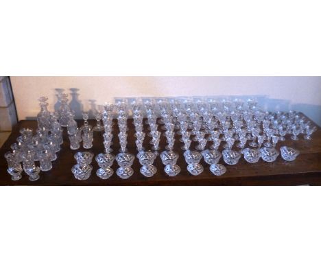 A large and very fine hand cut glass Drinking Suite, each glass/bowl/decanter cut with lozenges in relief and the Wines etc.,