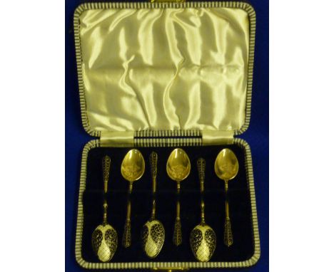 A mid 20th Century cased set of six silver and enamel Tea Spoons, each with gilded bowl, varying makers, two assay marks Shef