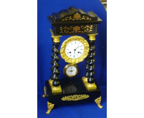 A late 19th Century ebonised, ormolu mounted and brass inlaid eight day Portico Clock, the individually numbered movement str