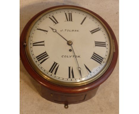 A good 19th Century circular mahogany framed Wall Clock, the 12" white enamel dial with Roman numerals and signed J. Tolman, 