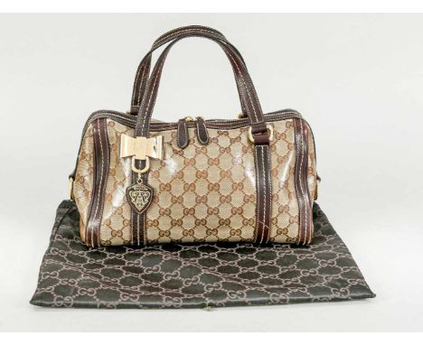 Handtasche von Gucci, Leder und gummierter Stoff mit Monogramrapport. Reißverschluss, Tragebügel. Schleifenapplikation in Gol