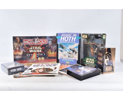 A COLLECTION OF STAR WARS COLLECTABLES, VHS, FIGURES AND GAMES, to include a sealed Star wars Trilogy Special Edition VHS box