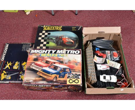 A BOXED TRIANG SCALEXTRIC GRAND PRIX G.P.1 MODEL RACING SET, featuring a red and a green car, track, triggers, fencing, trees