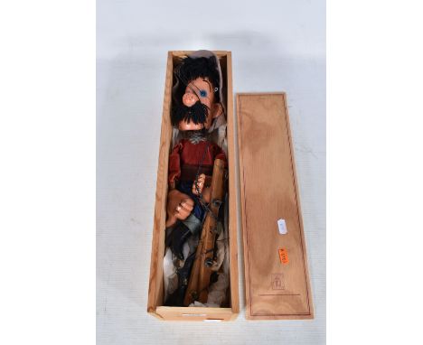 A BOXED PELHAM HANK THE COWBOY PUPPET, appears largely complete with both pistols but has some paint loss, marking and wear t