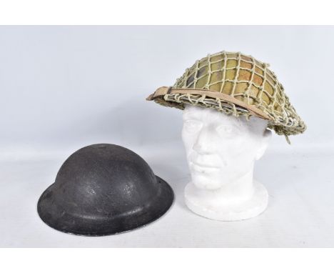 TWO WWII STEEL HELMETS, the first is light green in colour with a matching net, it comes with liner and chin strap, the secon