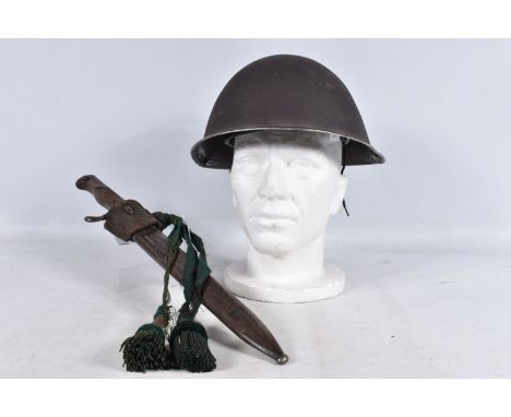 A GERMAN BUTCHER BAYONET AND STEEL HELMET, the bayonet blade is marked with the name Pack Ohliger &amp; Co Soligen and the gu