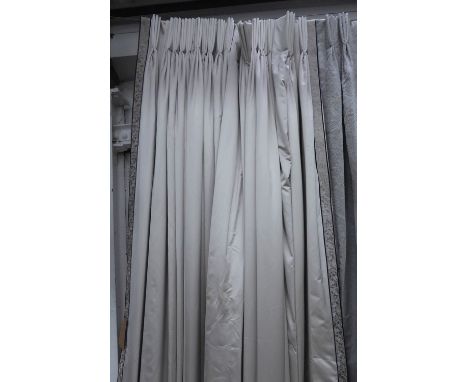 CURTAINS, three pairs, silvery satin with a woven border, lined and interlined, each curtain approx 125cm W gathered x 330cm 