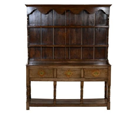 19th century oak dresser, with a two-shelf delft rack, the base with three drawers above a pot board base, W153cm D43cm H188c
