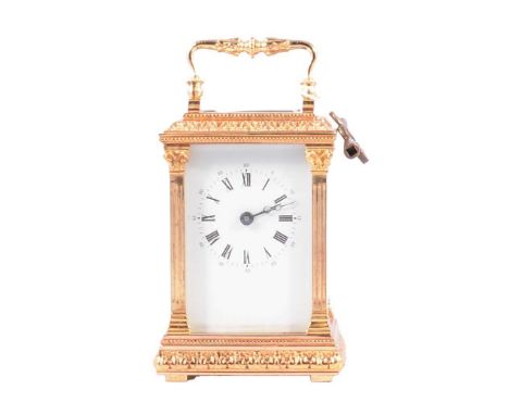 Modern English carriage clock, timepiece cast gilt metal case, with key, 12cm.