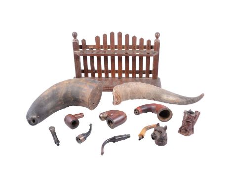 A carved wooden pipe in the form of a dog; a BBR carved pipe in the form of a Viking head; a silver-mounted plain polished wo