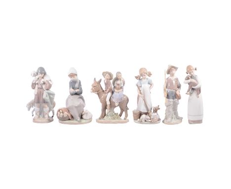Thirteen Lladro and Nao figurines, to include Lladro Ride in the Country 5354; Playful Kittens 5232; Valencian Girl 4841; and