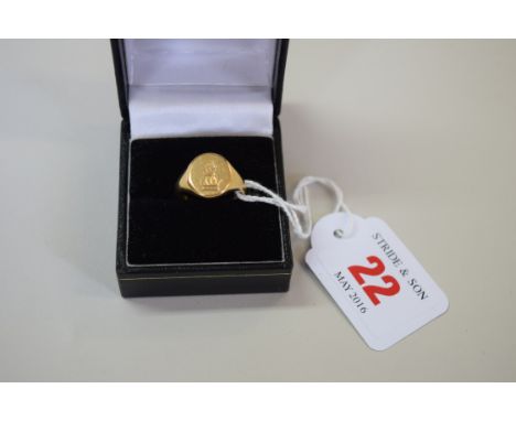 An 18ct gold signet ring, 8g. Condition Report: The ring has a British hallmark of 18ct.   Size M - N.  It has had light wear