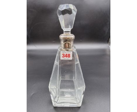 An Art Deco style cut glass decanter, having silver coloured collar, stamped VDM 950, 29cm high. 