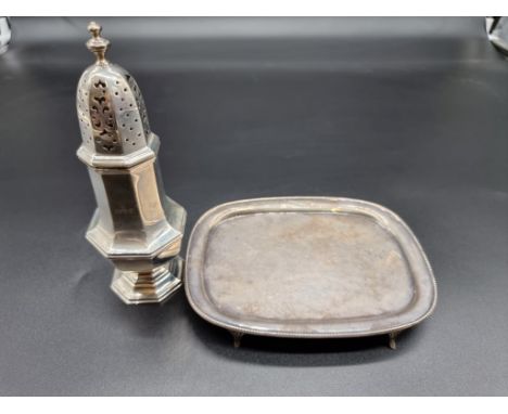 A silver teapot stand, maker's mark rubbed, Chester, date latter indistinct, 16.5cm wide, 148g; together with a silver sugar 