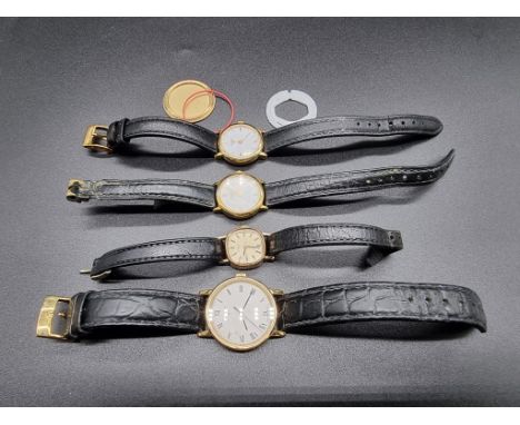 A Tissot 9ct gold manual wind ladies wristwatch, 18mm, on leather strap; together with three other Tissot gold plated quarts 