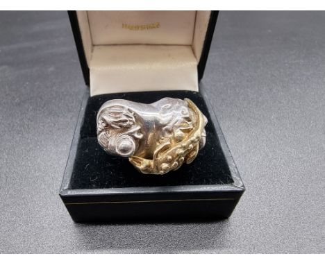 A ring decorated Eagle, fish and lizard, indistinctly signed 'Schul.. Berg' to shank and further marked sterling, size M. 