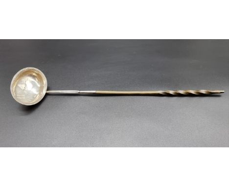 A George III silver toddy ladle, having baleen handle, by&nbsp;Elizabeth Morley, London 1812, 36cm. 