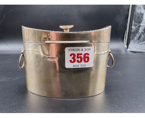 A silver tea caddy, makers mark rubbed, Birmingham 1918, 11cm wide, 192g. 