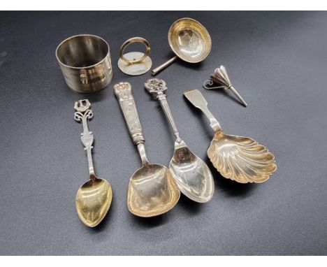 A small group of silver; to include a Victorian fiddle pattern caddy spoon, with shell shaped bowl and two golf teaspoons, 11