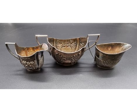 A Victorian silver cream jug and matching sugar bowl, by K Bros, London 1896/7; together with another silver cream jug, 252g.