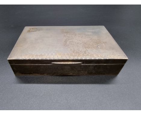 An engine turned silver cigarette box, Birmingham 1958, 14.6cm long. 