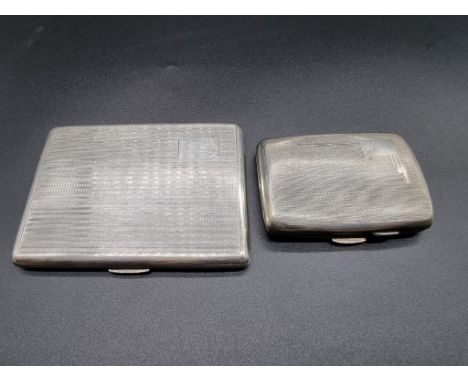 Two engine turned silver cigarette cases, gross weight 233g. 