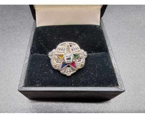 A white metal gem set ring, stamped 14k Gothic, size L. 