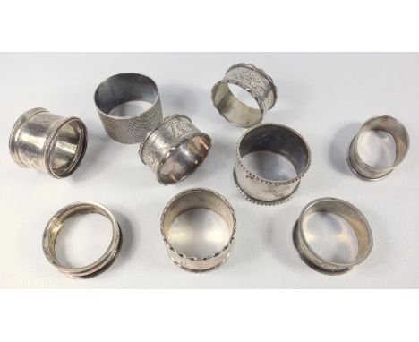 LATE VICTORIAN SILVER NAPKIN RING, PAIR OF EDWARDIAN NAPKIN RINGS, EACH WITH VACANT CARTOUCHE, LARGE NAPKIN RING AND FIVE LAT