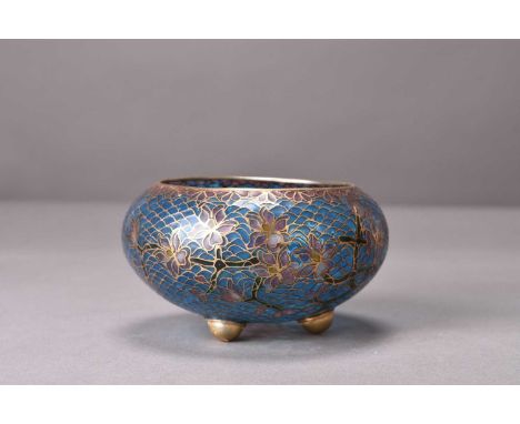 A Chinese plique a jour transparent enamel bowl, 20th centuryOf compressed ovoid form with three feet, worked with stylised m