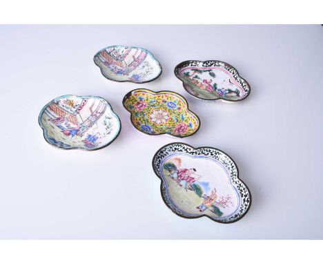 A group of Chinese enamel dishes, 18th century and laterOf quatrelobed form, four decorated with figures in landscapes, the f