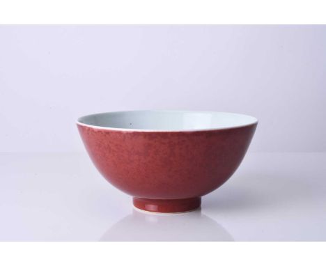 A Chinese copper red bowl, Qianlong seal mark and of the periodOf deep rounded form, the outside with a rich red glaze, thinn