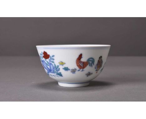 A Chinese Doucai porcelain chicken cupChenghua six-character mark but laterOf conical form and decorated in underglaze blue a