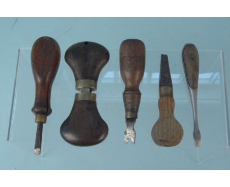 Four 'gunsmiths' turn screws with a nipple spanner