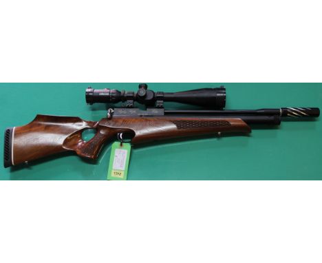 A 'Ripley' Elite P.C.P. air rifle complete with the Huggett sound moderator and a Konuspro-F30 8-32x56 scope, also included a