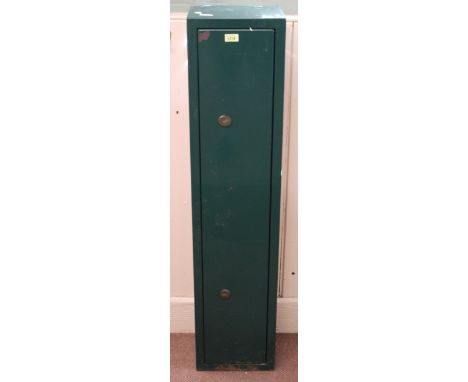 A four gun metal security cabinet with keys