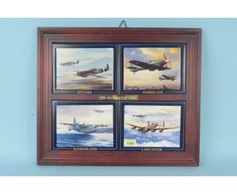 A set of four titled 'The Magnificent Four' WWII aircraft depicted on ceramic plaques within bespoke wooden frame