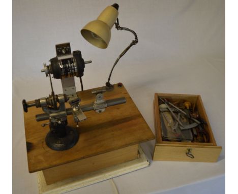 Mounted watchmakers lathe (believed to be BTM, marked B.TAB.M.Co1778/2416) attached to a universal motor with a desk lamp. Al